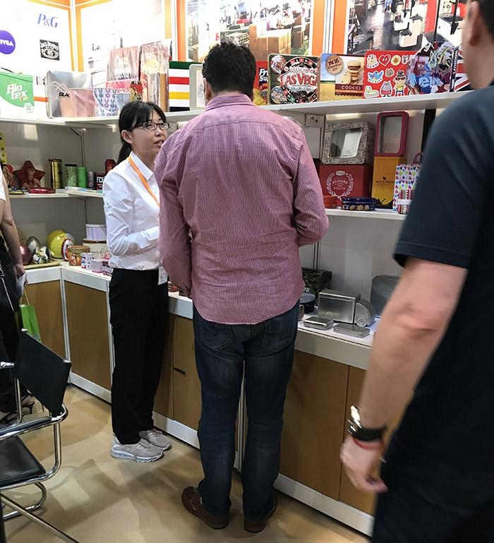Our sales representative is introducing our tin cans to customers - Brilliant Tin Box Manufacturing Co.,Ltd 