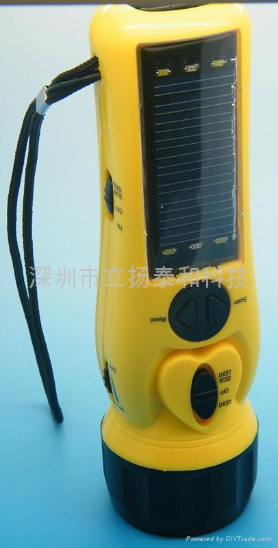 Solar charger with flashlight and radio  