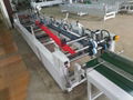 The fifth generation of automatic plastic box Nien box machine