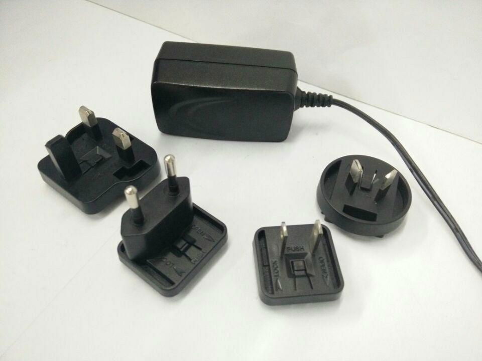 12V2A Power Adapter with interchangeable plugs for UK/EU/AU/US 3