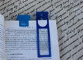 wafer-thin bookmark/name card/ruler magnifier