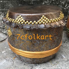 High pitch drum with golden handles, nails and fabric