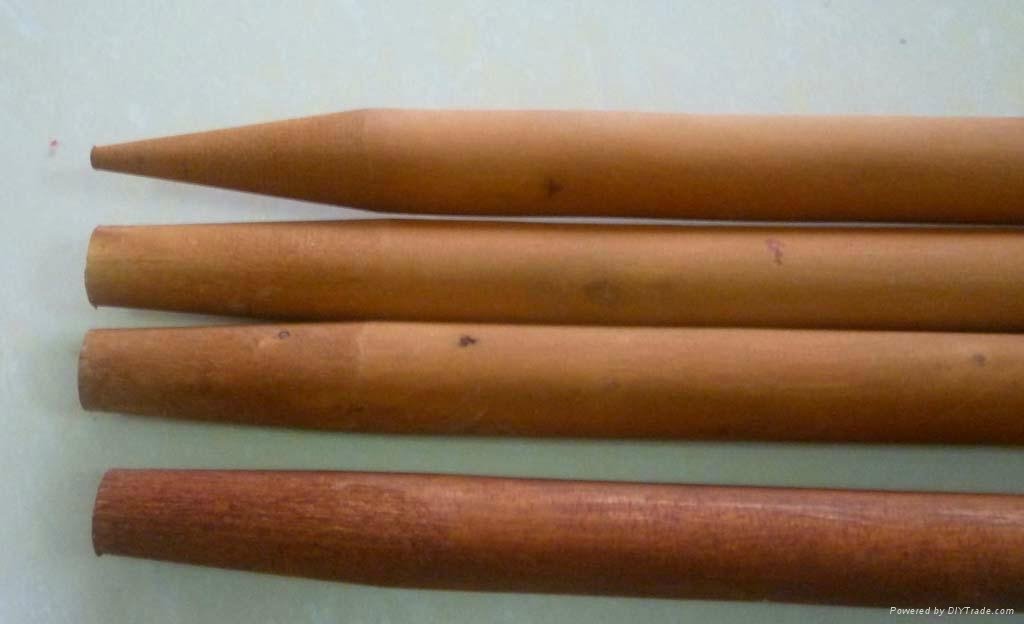 varnished wooden broom handle