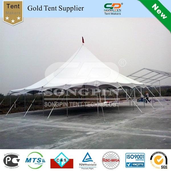 Solid white 40'x40' pole tent set with tables and chairs and dance floor 
