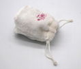 Fake fur lovely small drawstring bag in white with embroidery logo on front 