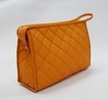 Bright yellow nylon quilted women makeup bag with snap at side for travel  3