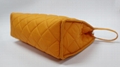 Bright yellow nylon quilted women makeup bag with snap at side for travel 