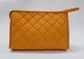 Bright yellow nylon quilted women makeup bag with snap at side for travel 