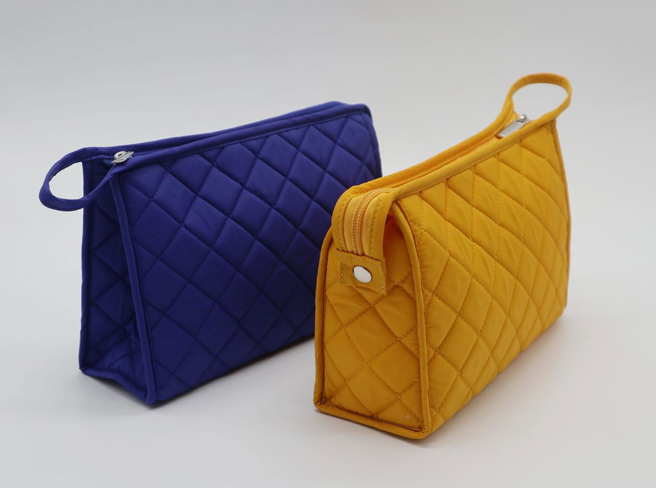 Bright yellow nylon quilted women makeup bag with snap at side for travel 