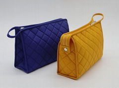 Bright yellow nylon quilted women makeup bag with snap at side for travel 