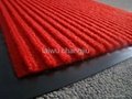 Door mat with PVC backing