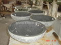 Granite bowl sink with natural cleft finish exterior