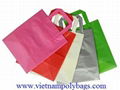 Tri-fold handle plastic bags