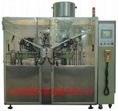 Tube filling and sealing machine