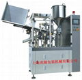 Tube filling and sealing machine