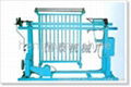 Shuttless weaving machine