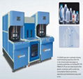 Plastic bottle blowing machine