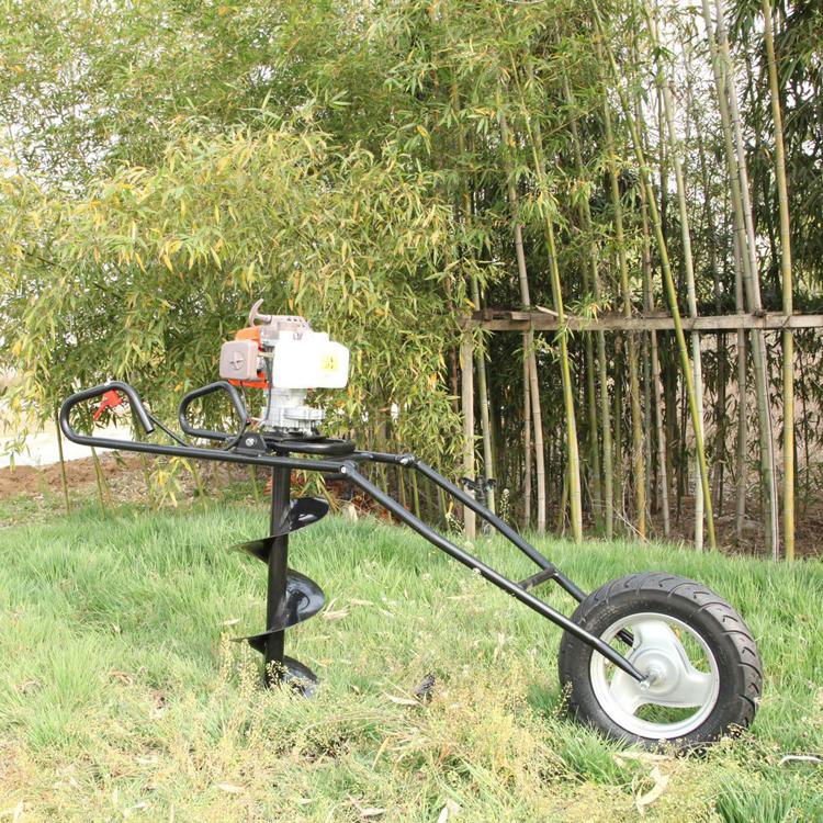 Hand-held earth auger