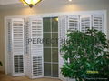 Bi-folding door folding panel plantation shutter white color window shutters 1