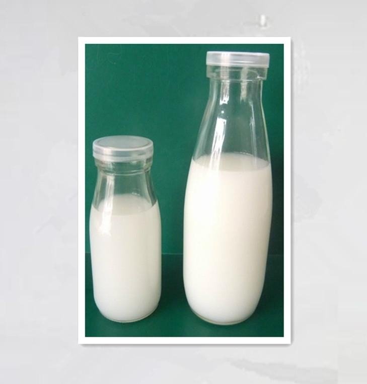 clear glass milk bottle