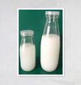 clear glass milk bottle