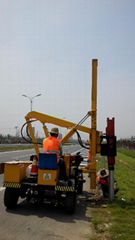 Highway guardrail pile driver