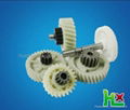 Plastic helical gear with metal shaft