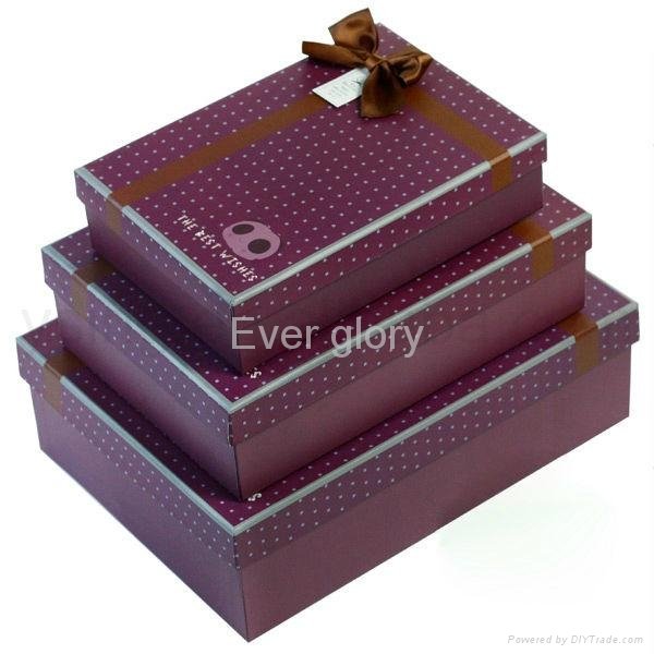 Nested cardboard set up gift box with ribbon bow