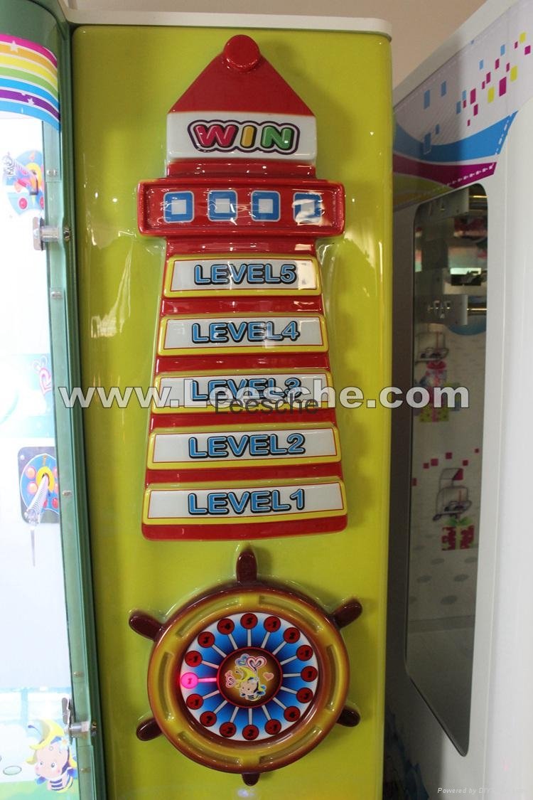 娱乐投币式自动售货游戏机灯塔夹娃娃机