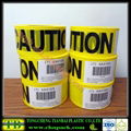 yellow caution barricade tape with black printing