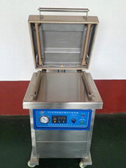 Small vertical food vacuum packaging machine