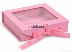 red hinged clamshell box with ribbon closure