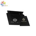 Black paper bag with silver logo 