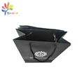 Black paper bag with silver logo 