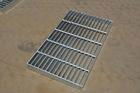 Swage locked steel grating