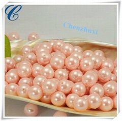 Pink plastic synthetic pearls