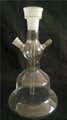 transparent glass bottle of hookah with smoking pipe