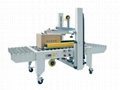 AUTOMATIC TOP AND SIDE BELT DRIVEN CASE SEALER