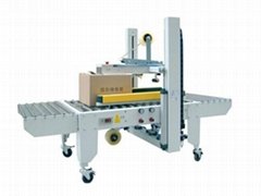 AUTOMATIC TOP AND SIDE BELT DRIVEN CASE SEALER