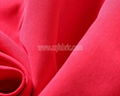 polyester fabric wholesale soft red alert 110gsm polyester peach skin plain for 