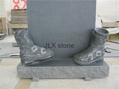 Grey granite headstone with shoes for grave cemetery