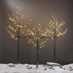 LED Christmas tree Snow White birch tree lights on a dying tree