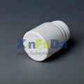 double cap of small plastic medicine bottle  1