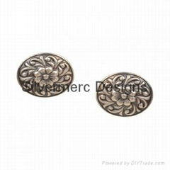 Embossed silver earring 