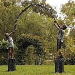 bronze children sculpture of children playing