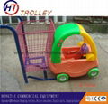   supermarket  children pushing shopping  trolley  with toy car  1