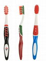 Toothbrush with Tongue Scrapper and Rubber tip massagers on head 1