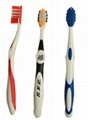 Toothbrush with Tongue Scrapper and Rubber tip massagers on head 1