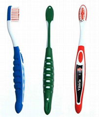 Toothbrush with tongue scrapper on head