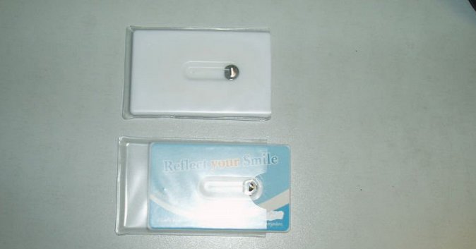 Credit card dental floss with mirror